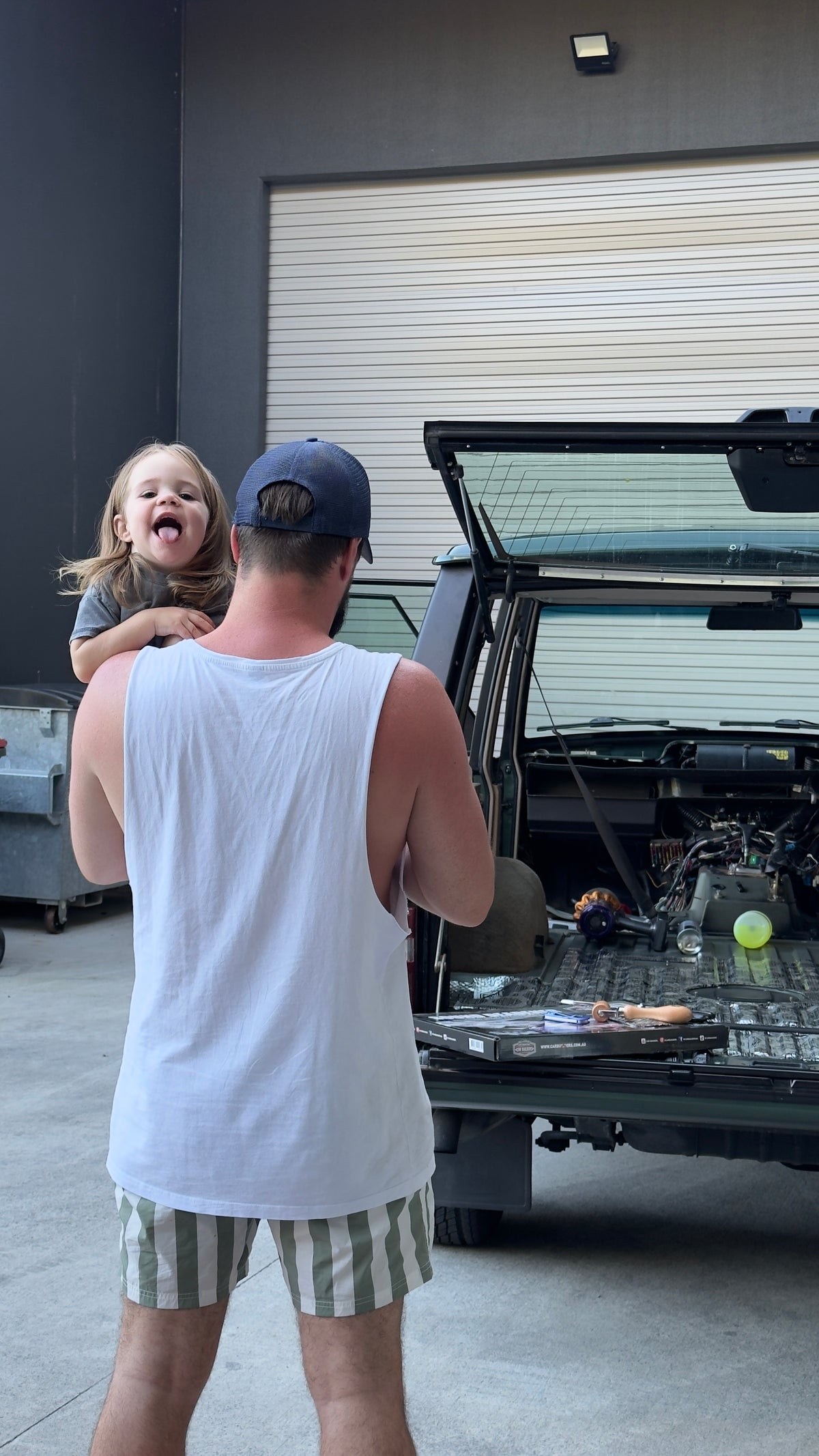 Aaron and Johnnie working on their Range Rover Classic