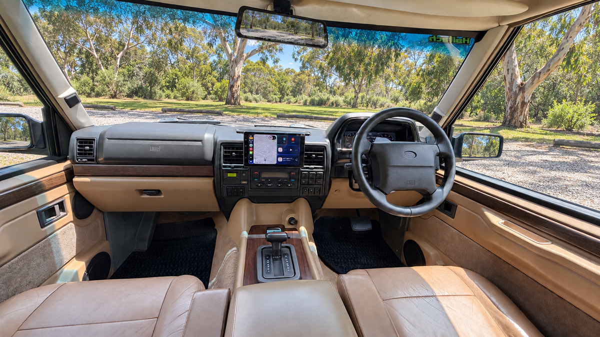 Tan Range Rover Classic cabin with factory-style controls